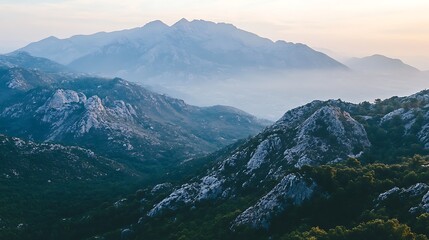 Naklejka premium Majestic Mountain Range at Dawn Scenic View