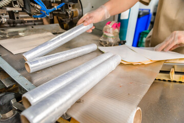 Packing material. Many rolls of stretch film are white transparent. Polymer product for wrapping.