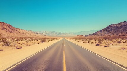 Desert Highway Stretching Towards Distant Mountains