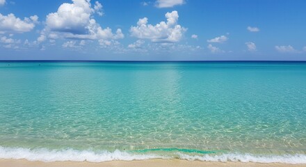Fototapeta premium Calm Ocean Water and White Sand Beach Under Bright Blue Sky