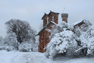 Old abandoned church in winter forest