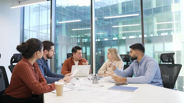 Group of business people communicate at conference meeting in office boardroom. Corporate team of professionals discussing startup strategy, engaging in decision, collaboration, communicating teamwork