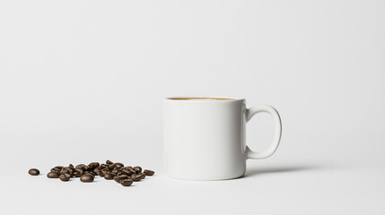 Obraz premium Morning Coffee: A simple, elegant photo of a white mug filled with coffee, accompanied by a small pile of dark roasted coffee beans. Perfect for minimalist designs and coffee-related projects.