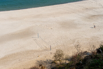 Empty Beach Volleyball Court on a Vast Sandy Shoreline Seen from Above in Jastrzębia Góra