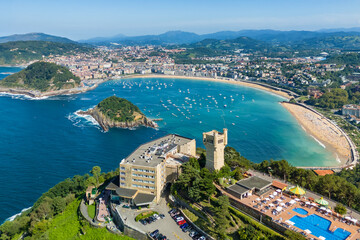 Flying over monte Igueldo Tower in San Sebastian city, Basque country, Spain