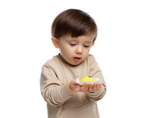 Cute little child with tasty mochi on white background