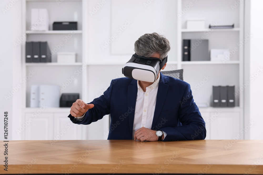 Poster man using virtual reality headset at desk in office