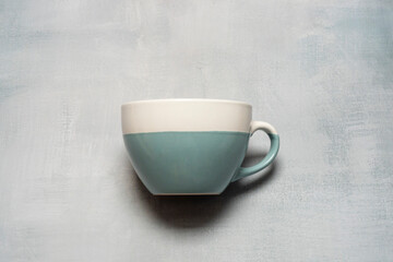 Empty matcha tea cup with copy space on gray background