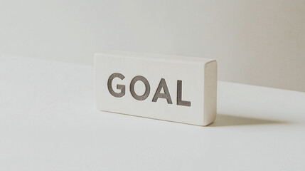 Goal Oriented: A minimalist image of a rectangular block with the word "GOAL" prominently displayed, symbolizing ambition, focus, and the pursuit of objectives.