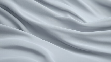 Fototapeta premium Light blue silk fabric draped in elegant soft folds and ripples under gentle studio lighting.