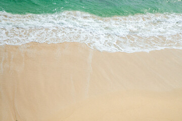 Tranquil Summer Seascape with Soft Waves Rolling Toward the Shore Under Clear Skies.