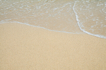 Refreshing Summer Seascape with Vibrant Ocean Waves and Sunlight Over the Calm Shore.