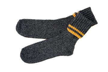 Top view of grey woolen winter socks on white background