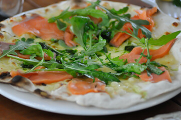 salmon pizza or salmon and vegetable pizza , smoked salmon pizza