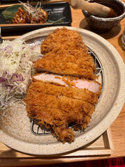 A plate of deep fried pork cutlet.