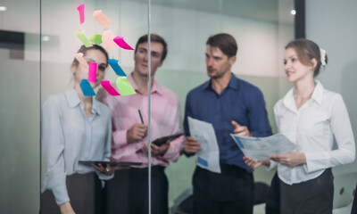 Businesspeople Using Sticky Notes for Strategic Planning
