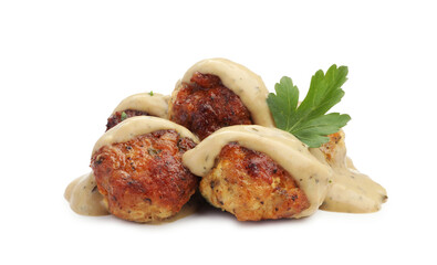 Delicious meatballs with creamy sauce isolated on white