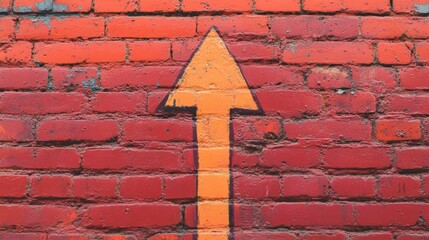 Orange arrow trending upwards on textured red bricks, symbolizing progress and success.