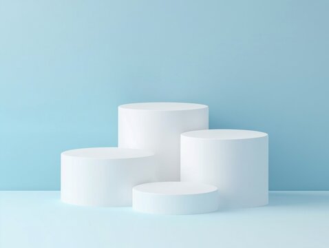 Four white cylindrical podiums set against a blue background.