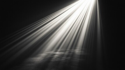 Rays of light shine down illuminating a dark surface