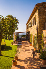 Terrace of the typical tiny charming restaurant located on the tuscany farm near the town of...