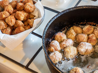 making meatballs on the kitchen