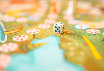 Board game with dice closeup. Playing games concept.	