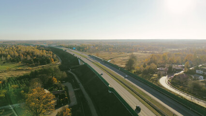 Top view of freeway with grass and cars