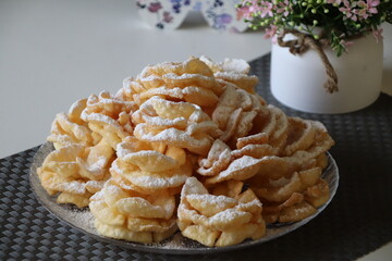 edible brushwood dessert with powdered sugar