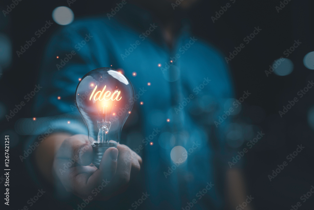 Poster businessman holding glowing idea inside lightbulb for creative thinking idea and problem solving sol