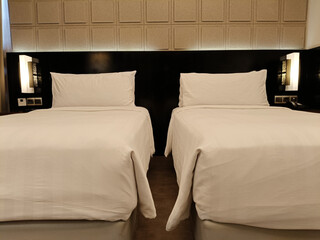 Inviting Hotel Room With Two Single Beds And Minimalist Interior Design