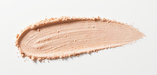 Fototapeta premium A smooth powder coating spreads across a flat surface, showcasing its fine texture and soft peachy hue. The blending demonstrates creamy application potential for cosmetics