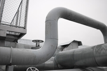 pipeline line against grey sky and forest