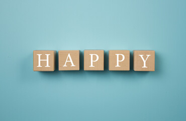 The word Happy written on wooden cubes.