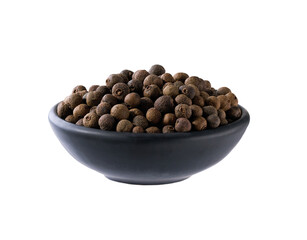 black ceramic bowl with allspice or Jamaican pepper isolated on white background.