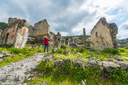 Skeletal Stone Ruins of Kayak&ouml;y Ghost Village Under Dramatic Skies in Fethiye, Turkey