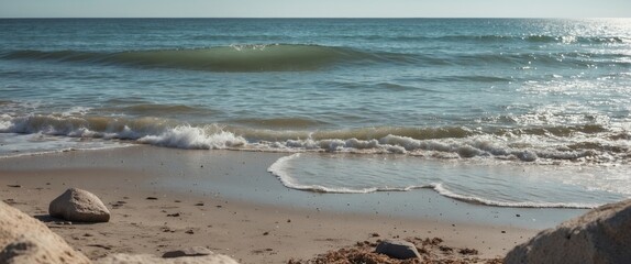 Tranquil beach scene with gentle waves and clear skies ideal for text overlay and backgrounds in promotional materials and advertisements