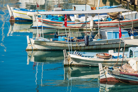 Traditional Fishing Boats and Gulets Moored in the Scenic Harbor of Kalkan, Turkey