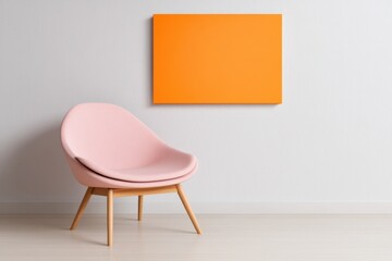Pink Chair with orange artwork on white wall
