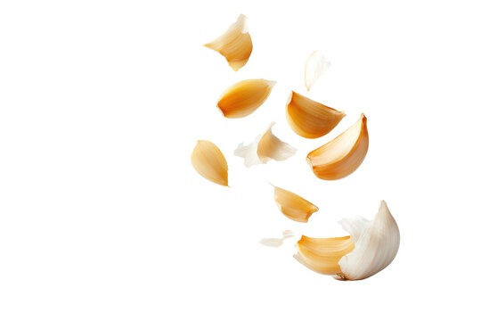 Delicious garlic cloves broken and scattered, showcasing freshness and flavor., transparent background.