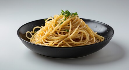 Classic Spaghetti Served in a Black Bowl with Fresh Herbs and Empty Space for Text on a White Background