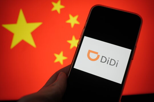 Roosendaal, The Netherlands - February 15, 2025: A mobile phone displaying the logo of Didi Global, with the Chinese flag in the background.