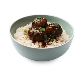 Delicious rice with meatballs, sauce and green onions in bowl isolated on white