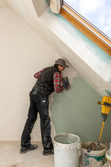 Construction Worker Plastering Wall – Renovation and Drywall Repair