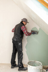 Construction Worker Plastering Wall – Renovation and Drywall Repair