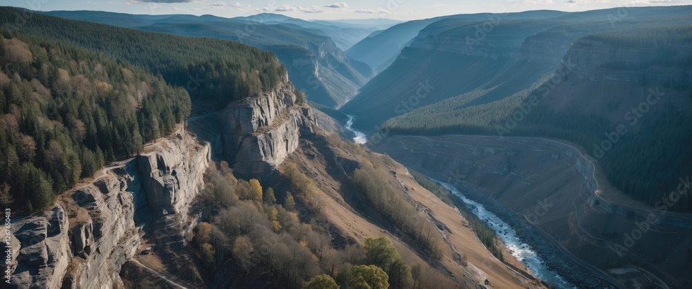 Aufkleber aerial view of majestic mountain range with serene ravine and lush forest highlighted by vast copy s