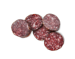 Pieces of delicious dry cured sausage isolated on white, top view