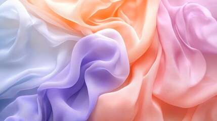 Obraz premium A soft, flowing fabric in pastel colors of white, lavender, peach, and pink, creating a delicate and airy texture.
