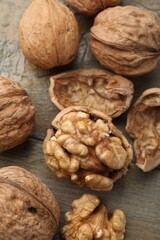 Fresh walnuts on wooden table, flat lay