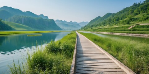 Scenic Natural Landscape Featuring Serene Lakes and Lush Grasslands Along a Wooden Pathway Ideal for Tranquil Outdoor Experiences